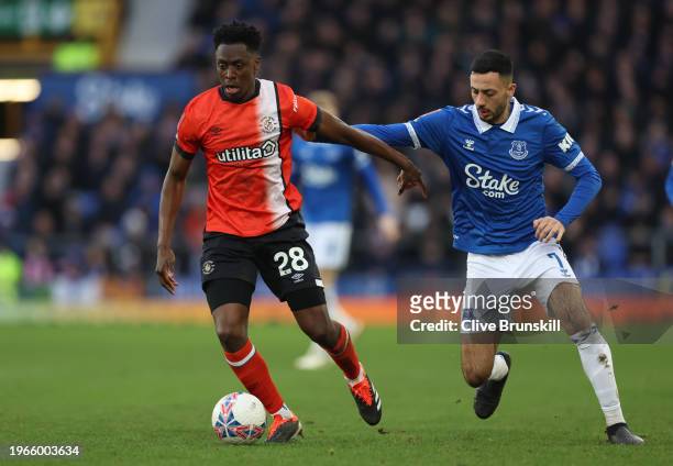 Albert Sambi Lokonga of Luton Town is challenged by Dwight McNeil of Everton during the Emirates FA Cup Fourth Round match between Liverpool and...