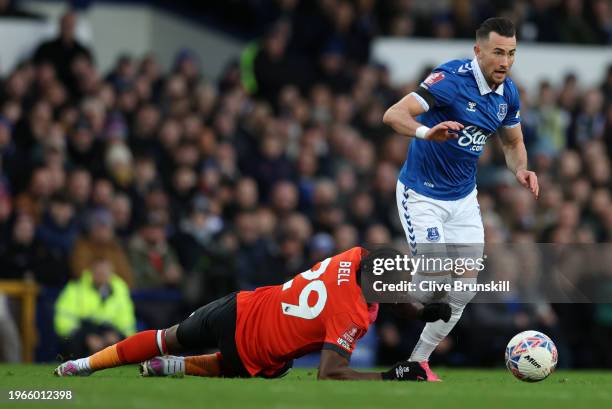 Jack Harrison of Everton runs on past Amarl'i Bell of Luton Town to score his teams first goal during the Emirates FA Cup Fourth Round match between...