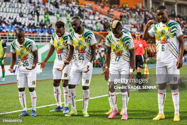 Mali's forward Lassine Sinayoko celebrates with teammates after scoring his team's second goal during the Africa Cup of Nations 2024 round of 16...