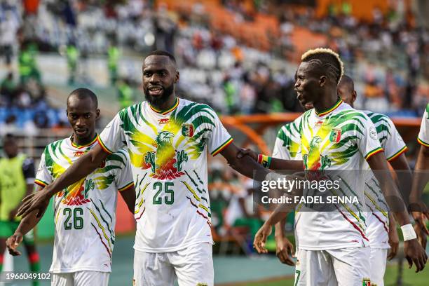 Mali's forward Lassine Sinayoko celebrates with teammates after scoring his team's second goal during the Africa Cup of Nations 2024 round of 16...