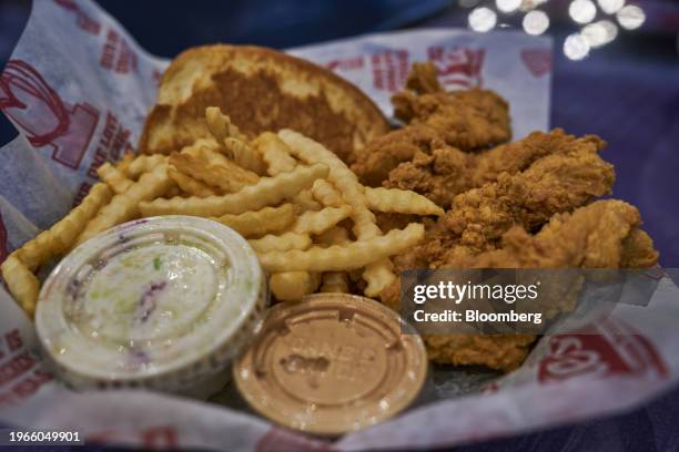 Box combo, containing chicken tenders, french fries, Texas toast and coleslaw, arranged during opening day at a Raising Cane's restaurant at the...