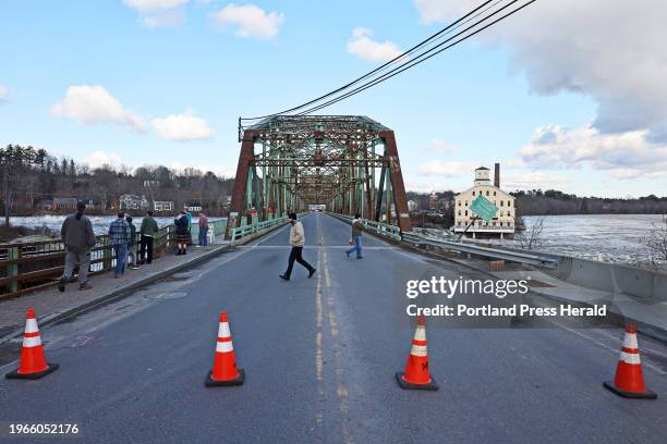 The Frank J. Woods Bridge that spans the Androscoggin River between Brunswick and Topsham was closed Tuesday due to high water from Monday's storm.