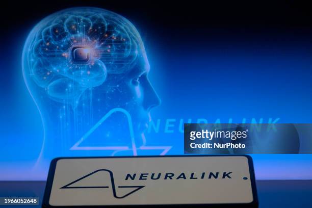The Neuralink logo is displayed on a smartphone with Neuralink visible in the background in this photo illustration in Brussels, Belgium, on January...