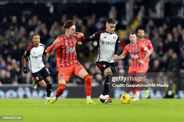 Andreas Pereira of Fulham is challenged by James Garner of Everton during the Premier League match between Fulham FC and Everton FC at Craven Cottage...