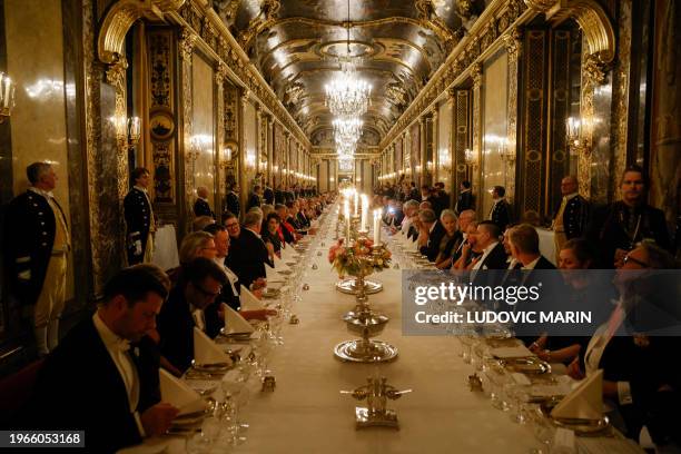 Guests attend a state dinner with French President Emmanuel Macron at the Royal Palace in Stockholm, Sweden on January 30, 2024. French President...