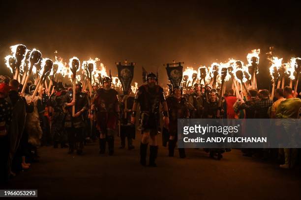 Members of the Up Helly Aa 'Jarl Squad' parade through the streets of in Lerwick, Shetland Islands on January 30, 2024 during the Up Helly Aa...