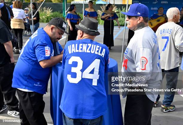 Los Angeles, CA Locals wearing Fernando Valenzuela jerseys eat tacos during a Taco Tuesday event at Homeboy Industries in Los Angeles on Tuesday,...