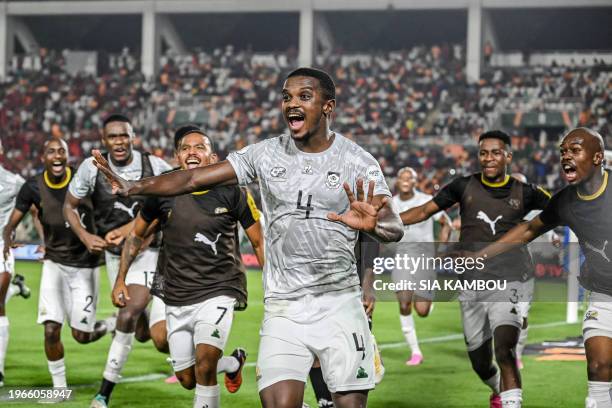 South Africa's midfielder Teboho Mokoena celebrates with teammates after scoring a goal during the Africa Cup of Nations 2024 round of 16 football...