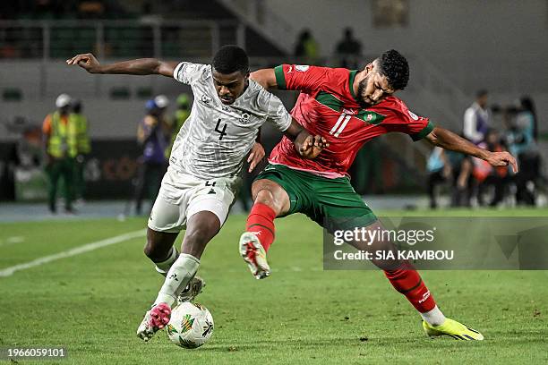 Morocco's midfielder Ismael Saibari fights for the ball with South Africa's midfielder Teboho Mokoena during the Africa Cup of Nations 2024 round of...