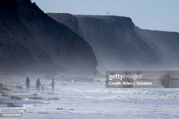 Jalama State Beach, CA Beach-goers walk along the beach, near the Jalama creek estuary at Jalama State Beach, where Southern California steelhead...