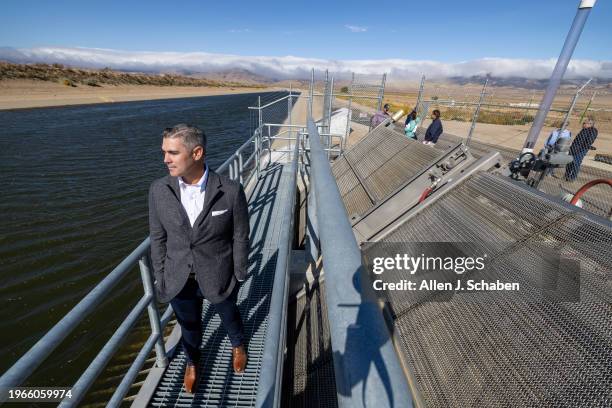 Lancaster, CA Justin Livesay, left, engineering manager, Antelope Valley East Kern Water Agency, stands on the new turnout facility from the...