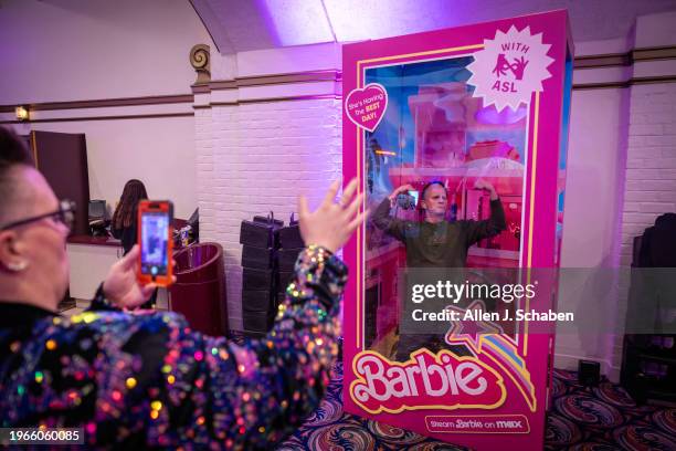 Westwood, CA Katherine Lees, left, photographs Mark Fresquez inside a large Barbie box as they arrive to attend the US. Deaf West and Max hosting a...