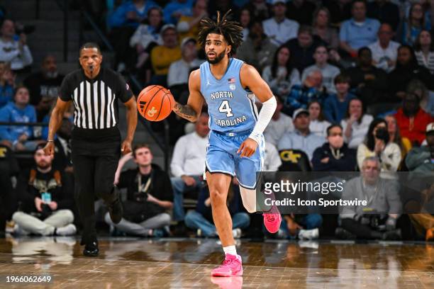 North Carolina guard RJ Davis brings the ball up the court during the college basketball game between the North Carolina Tar Heels and the Georgia...