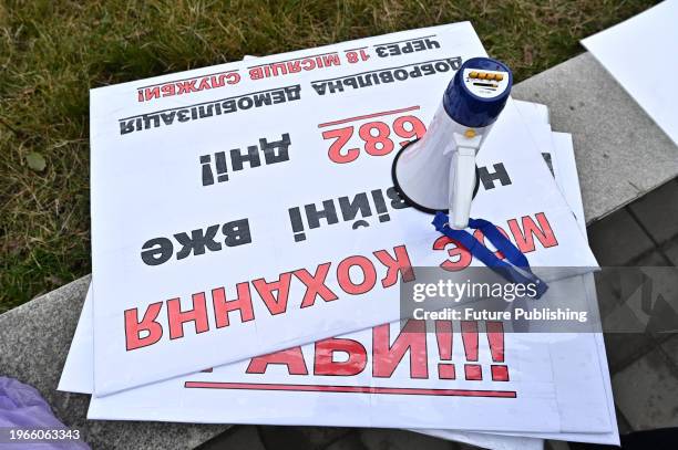 Megaphone and placards are seen during a rally of military relatives to demand the demobilization of soldiers after 18 months of service outside...