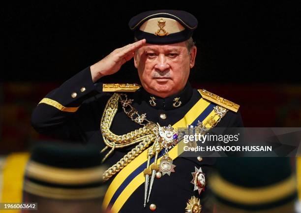 King of Malaysia Sultan Ibrahim Iskandar salutes the guard of honour during a welcoming ceremony at the National Palace in Kuala Lumpur, on January...