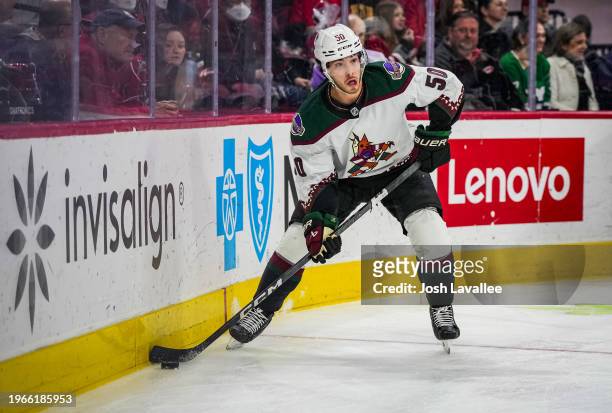 Sean Durzi of the Arizona Coyotes skates during the first period against the Carolina Hurricanes at PNC Arena on January 27, 2024 in Raleigh, North...