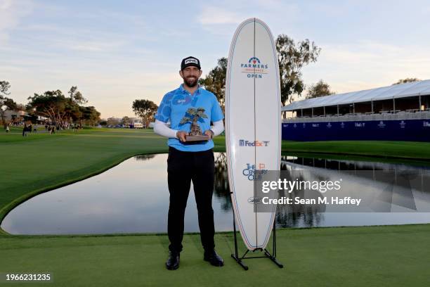 Matthieu Pavon of France poses with the trophy after winning the Farmers Insurance Open at Torrey Pines South Course on January 27, 2024 in La Jolla,...