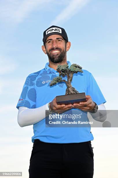 Matthieu Pavon of France poses with the trophy after winning the Farmers Insurance Open at Torrey Pines South Course on January 27, 2024 in La Jolla,...