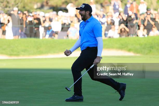 Matthieu Pavon of France celebrates on the 18th green after making birdie to win the Farmers Insurance Open at Torrey Pines South Course on January...
