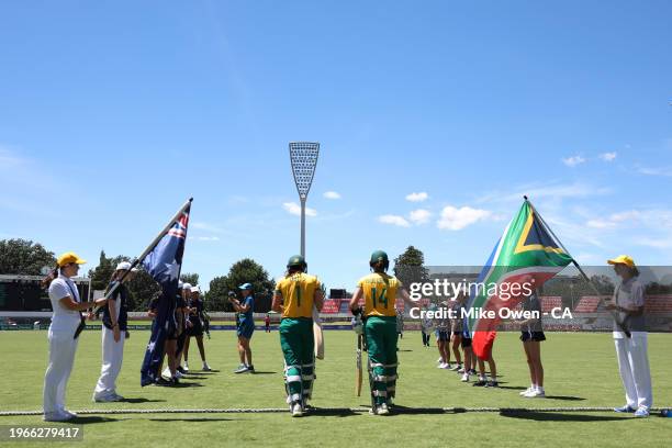 Tazmin Brits and Laura Wolvaardt of South Africa walk out onto the field during game two of the Women's T20 International series between Australia...