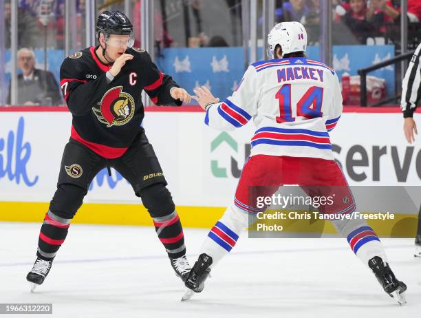 Brady Tkachuk of the Ottawa Senators fights Connor Mackey of the New York Rangers during the second period at Canadian Tire Centre on January 27,...