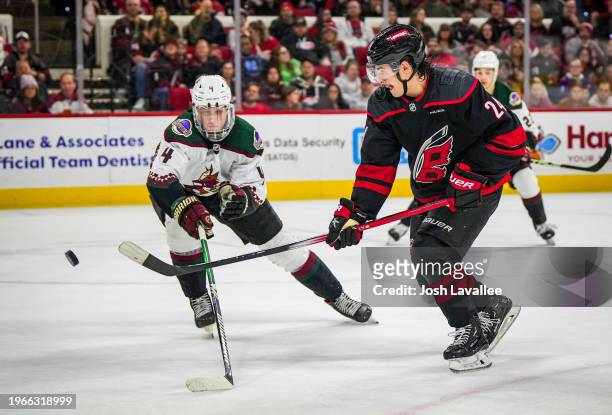 Seth Jarvis of the Carolina Hurricanes shoots the puck during the second period against the Arizona Coyotes at PNC Arena on January 27, 2024 in...