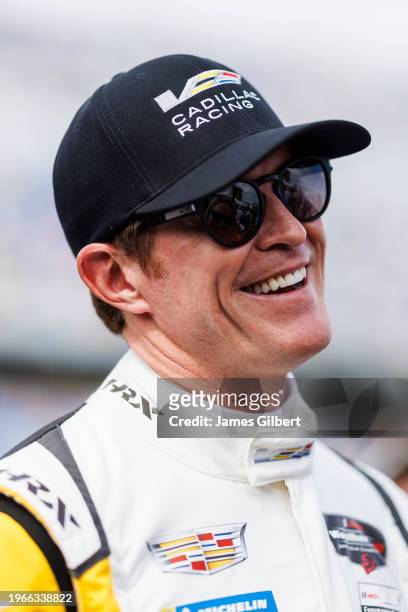 Scott Dixon driver of The Cadillac Racing Cadillac V- Series.R looks on before the start of the Rolex 24 at Daytona International Speedway on January...