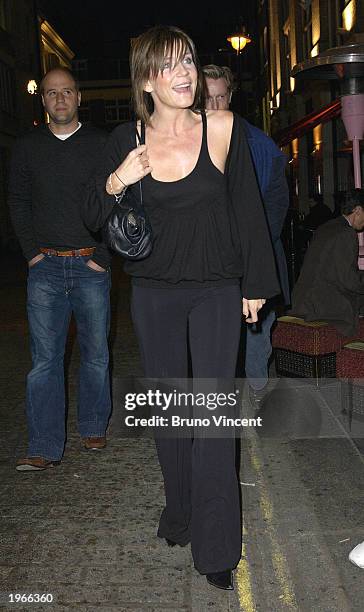 Actress Michelle Collins arrives at the re-launch party of Bizarre, the Sun Newspaper's celebrity gossip section, at Momo May 1, 2003 in London.