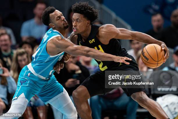Ish Smith of the Charlotte Hornets guards Collin Sexton of the Utah Jazz in the third quarter during their game at Spectrum Center on January 27,...