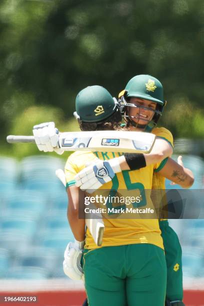 Chloe Tryon of and Laura Wolvaardt of South Africa celebrate victory during game two of the Women's T20 International series between Australia and...