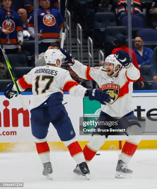 Oliver Ekman-Larsson of the Florida Panthers scores the game-winning goal against the New York Islanders at 1:56 of overtime at UBS Arena on January...