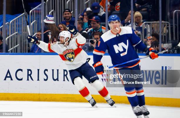 Oliver Ekman-Larsson of the Florida Panthers scores the game-winning goal against the New York Islanders at 1:56 of overtime at UBS Arena on January...