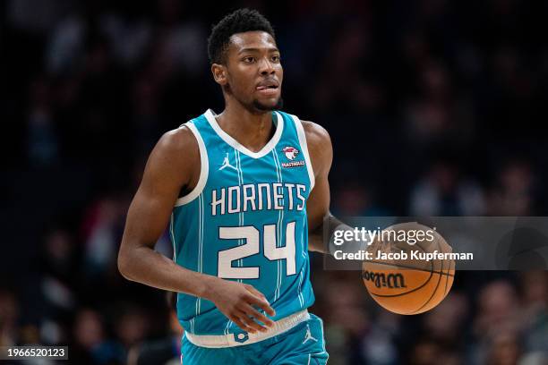 Brandon Miller of the Charlotte Hornets brings the ball up court against the Utah Jazz during their game at Spectrum Center on January 27, 2024 in...