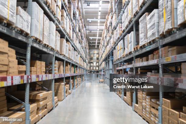 background distribution warehouse with cardboard boxes on the racks - inventory management stock pictures, royalty-free photos & images