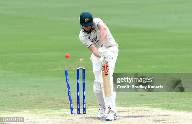 Cameron Green of Australia is bowled out by Shamar Joseph of the West Indies during day four of the Second Test match in the series between Australia...