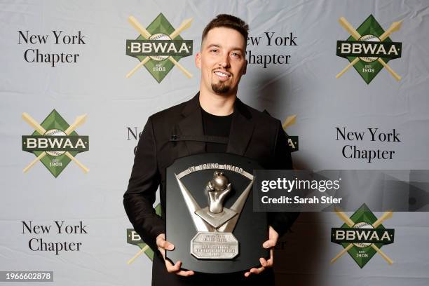 Former San Diego Padres pitcher Blake Snell poses with the 2023 National League Cy Young Award during the 2024 BBWAA Awards Dinner at New York Hilton...
