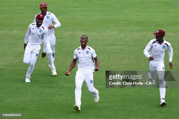 Shamar Joseph of West Indies celebrates dismissing Travis Head of Australia during day four of the Second Test match in the series between Australia...