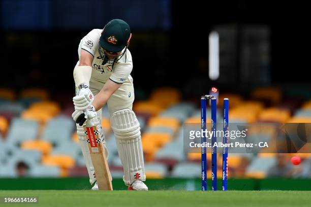 Travis Head of Australia is bowled out by Shamar Joseph of West Indies during day four of the Second Test match in the series between Australia and...