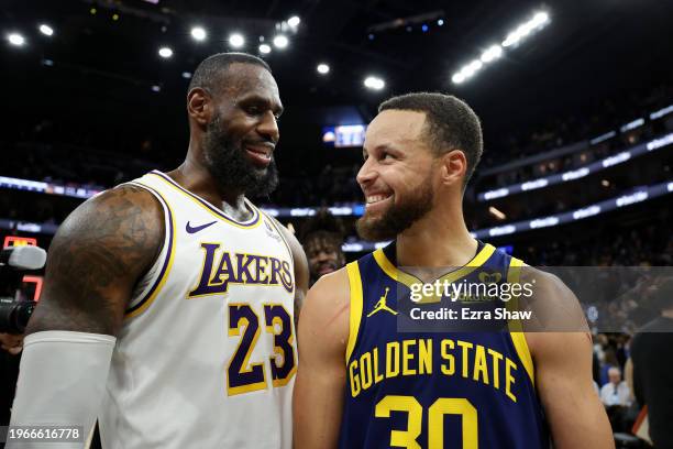 LeBron James of the Los Angeles Lakers and Stephen Curry of the Golden State Warriors talk to each other after the Lakers beat the Warriors in double...