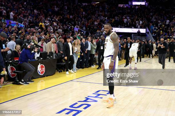 LeBron James of the Los Angeles Lakers stands on the court after they beat the Golden State Warriors in double overtime at Chase Center on January...