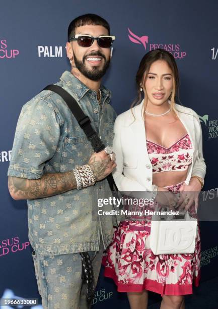 Anuel AA and Laury Saavedra attend Pegasus World Cup 2024 at Gulfstream Park on January 27, 2024 in Hallandale, Florida.