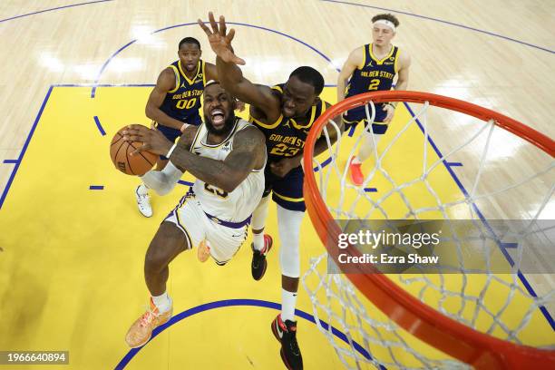 LeBron James of the Los Angeles Lakers is fouled by Draymond Green of the Golden State Warriors with one second left in double overtime at Chase...