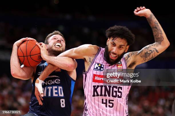 Matthew Dellavedova of United is fouled by Denzel Valentine of the Kings during the round 17 NBL match between Sydney Kings and Melbourne United at...