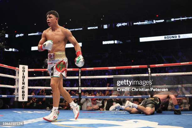 Jaime Munguia of Mexico reacts after knocking down John Ryder of Great Britain during the WBC silver super middleweight title fight at Footprint...