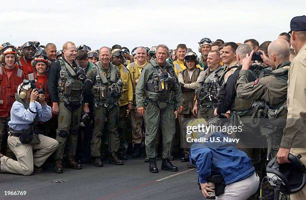 President George W. Bush greets sailors after landing in a S-3B Viking jet on the carrier USS Abraham Lincoln May 1, 2003 at sea off the California...