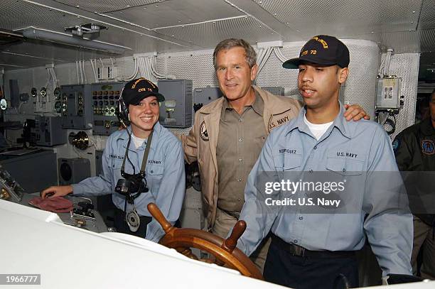 President George W. Bush takes a tour of the bridge during a his visit aboard the carrier USS Abraham Lincoln May 1, 2003 at sea off the California...