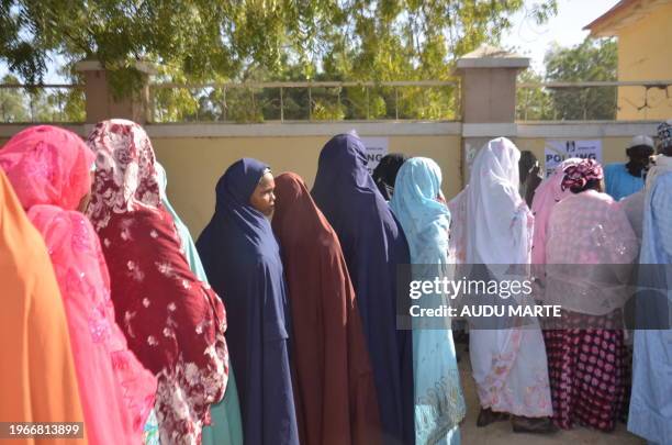 Voters queue at a polling station during a local election in Damasak on January 20, 2024.