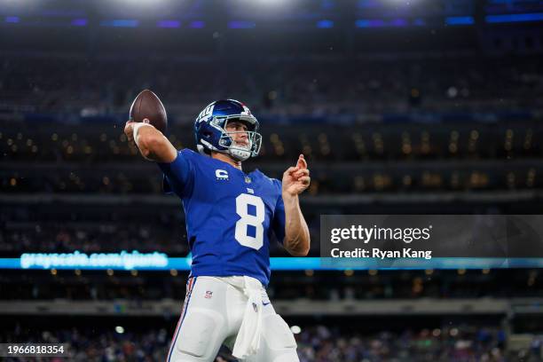 Daniel Jones of the New York Giants drops back and looks to throw a pass during pregame warmups prior to an NFL football game against the Dallas...