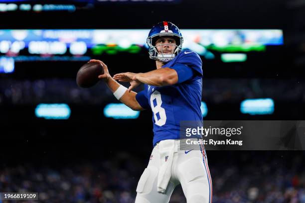 Daniel Jones of the New York Giants drops back and looks to throw a pass during pregame warmups prior to an NFL football game against the Dallas...