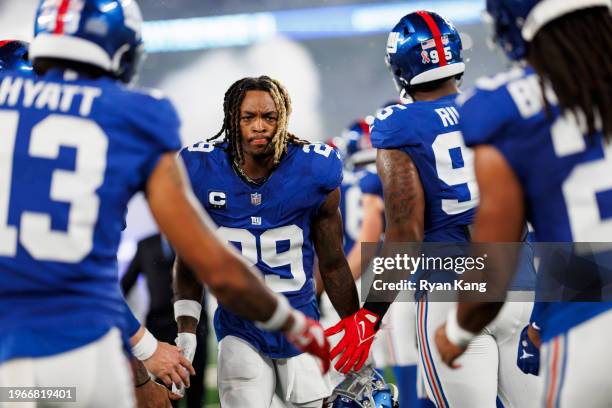 Xavier McKinney of the New York Giants runs onto the field during player introductions prior to an NFL football game against the Dallas Cowboys at...